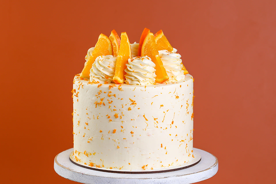 Сointreau cake decorated with Cointreau cream cheese frosting and orange zest